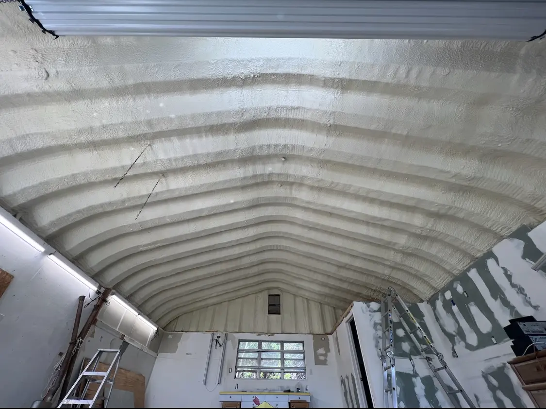 Spray polyurethane foam applied to the underside of a metal roof deck in Old Tappan